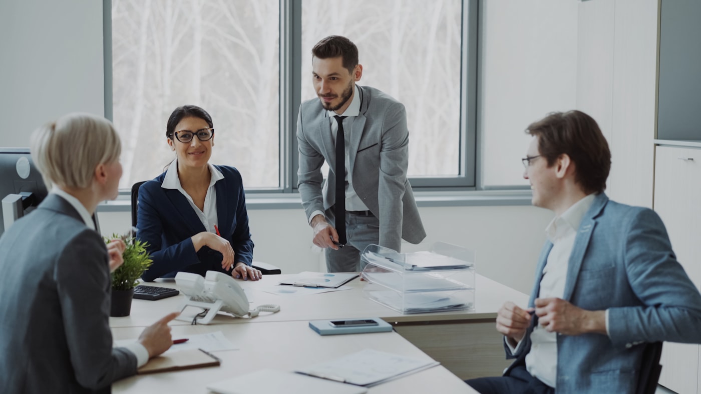 Executive team analyzing business data in a modern office
